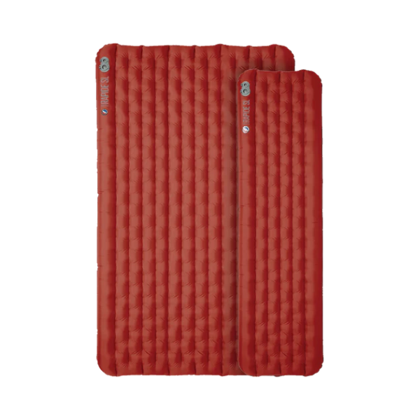 Two red quilted sleeping pads on a white background