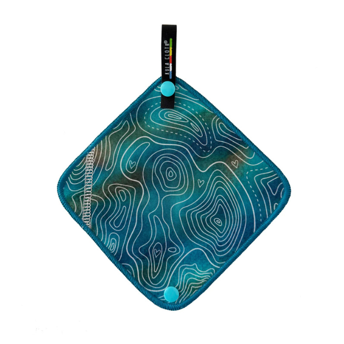 Teal kula cloth with white line contour pattern on a white background