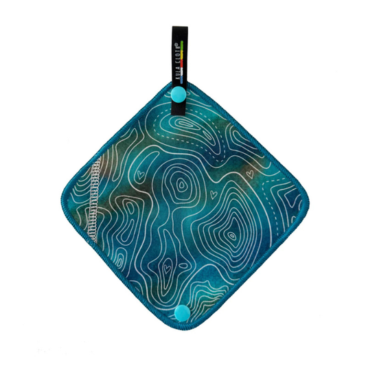 Teal kula cloth with white line contour pattern on a white background
